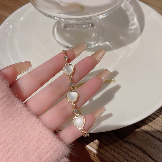 Golden Heart Charm Bracelet – Elegant Pearl-Style Love Jewelry